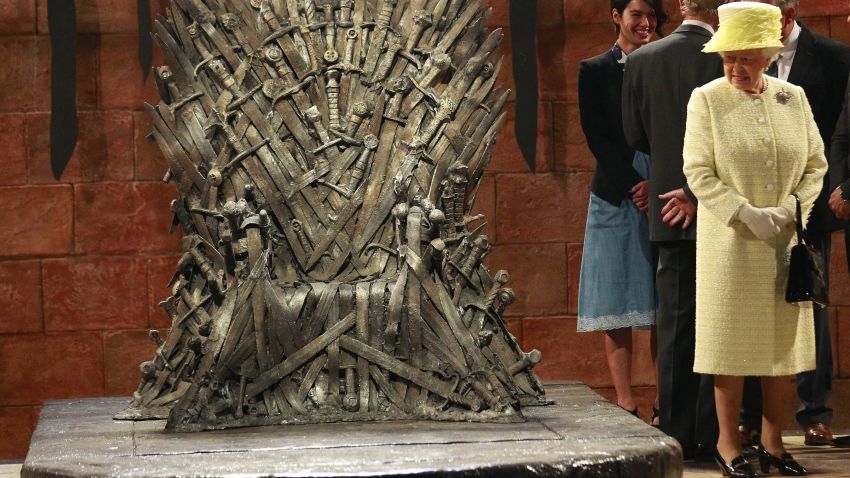 Britain's Queen Elizabeth visits the throne room at the set of the Game of Thrones TV series in Titanic Quarter, in Belfast Northern Ireland, Tuesday, June, 24, 2014.