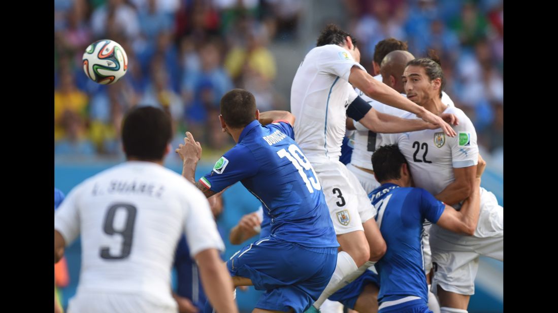 Uruguay's Diego Godin, second right, scores against Italy on June 24 in Natal, Brazil. Uruguay won 1-0.
