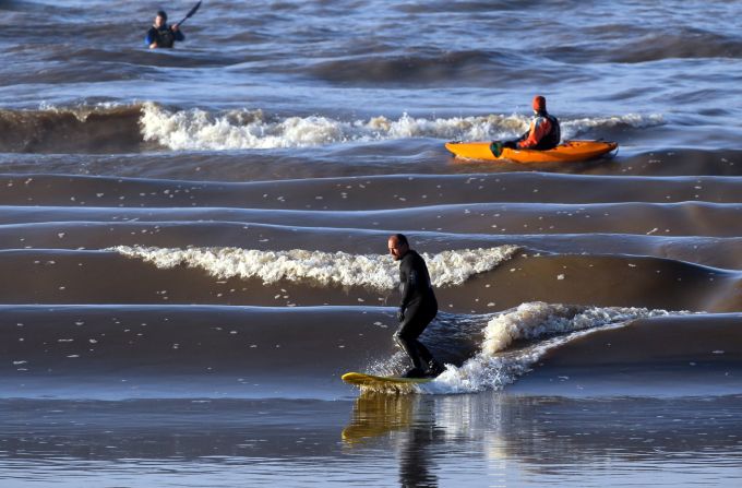 The Severn Bore in Gloucestershire, UK, is created when rising tides in the Bristol Channel force water up the Severn Estuary, creating waves of up to 2.8 meters. One surfer once rode the wave for five miles. 