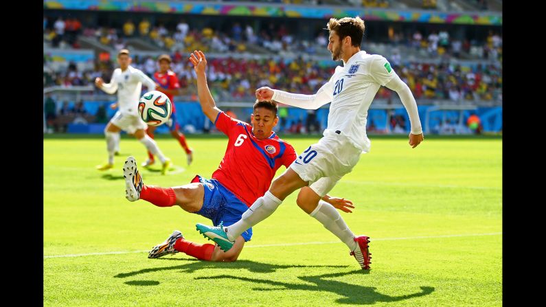 Adam Lallana of England is challenged by Oscar Duarte of Costa Rica during a match at Estadio Mineirao in Belo Horizonte. The game ended in a 0-0 draw.