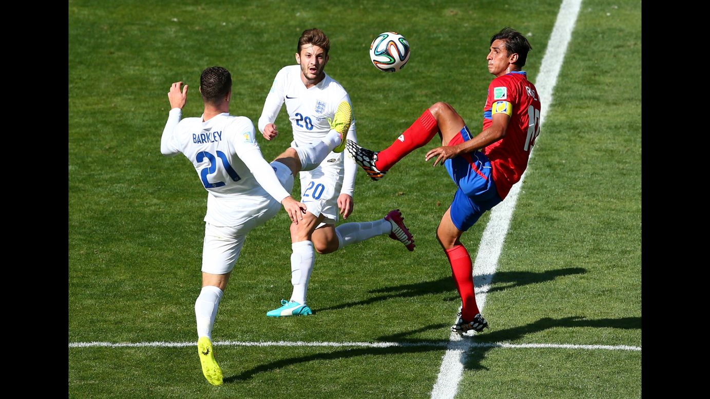Bryan Ruiz of Costa Rica competes for the ball with Ross Barkley, left, and Adam Lallana of England. 