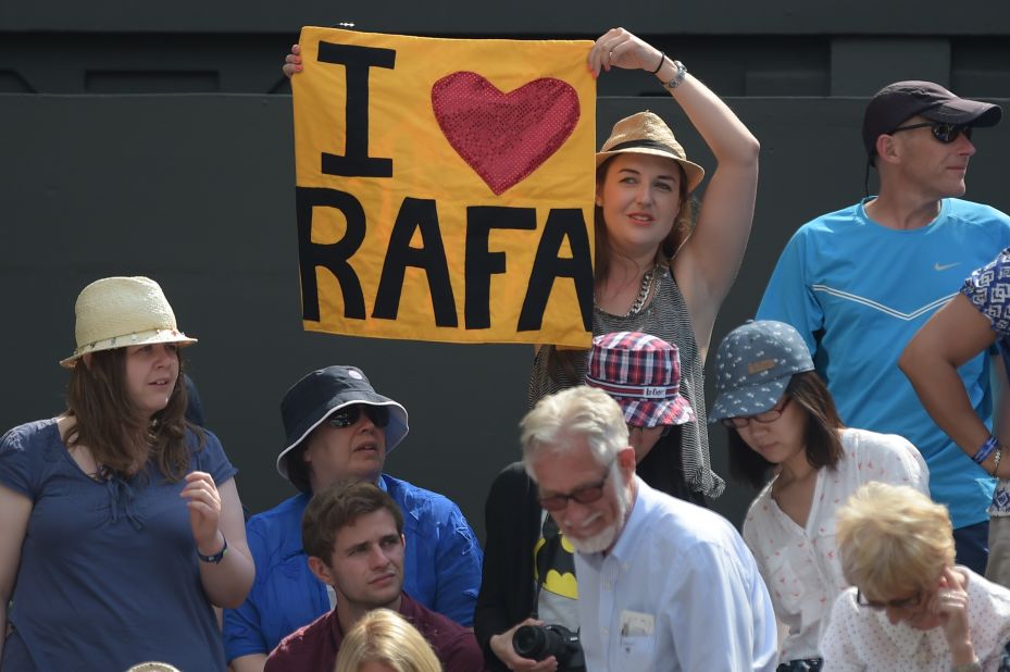 A spectator holds up a sign supporting Nadal during his match with Klizan.
