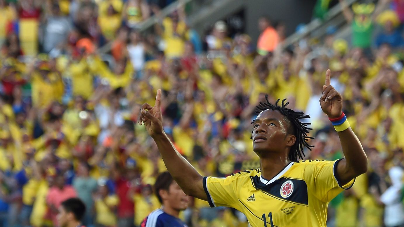 Colombia's Juan Guillermo Cuadrado celebrates after scoring a penalty.