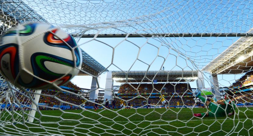 Colombia's Juan Guillermo Cuadrado scores a penalty during the match against Japan.