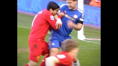 Suarez, left, was banned for 10 games in April 2013 after being found guilty of biting Chelsea defender Branislav Ivanovic during a English Premier League soccer match.