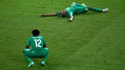 A dejected Wilfried Bony, left, and Die Serey of the Ivory Coast react after being defeated by Greece 2-1 during a World Cup match on Tuesday, June 24, in Fortaleza, Brazil.