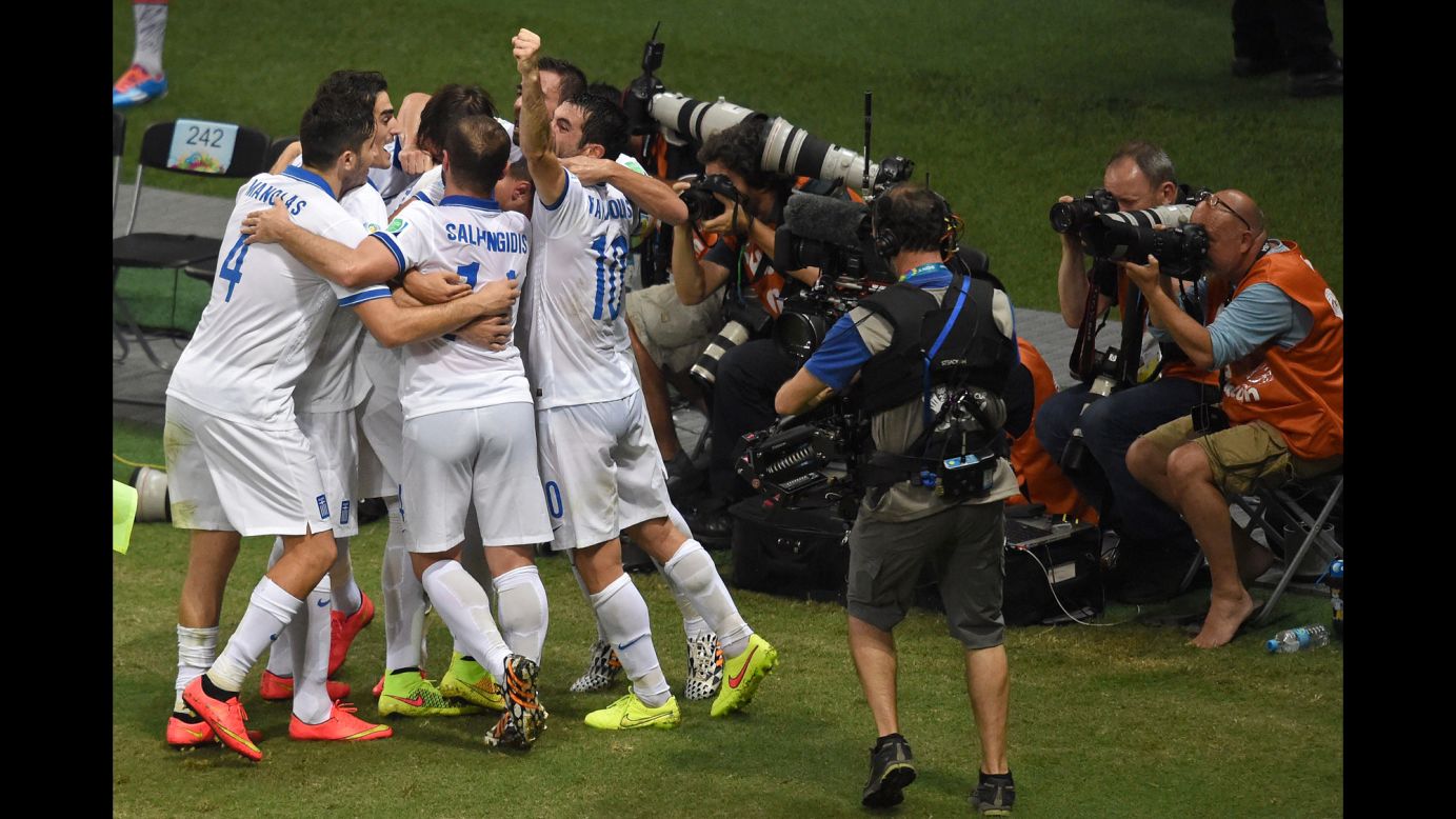 Greece's players celebrates scoring against the Ivory Coast.