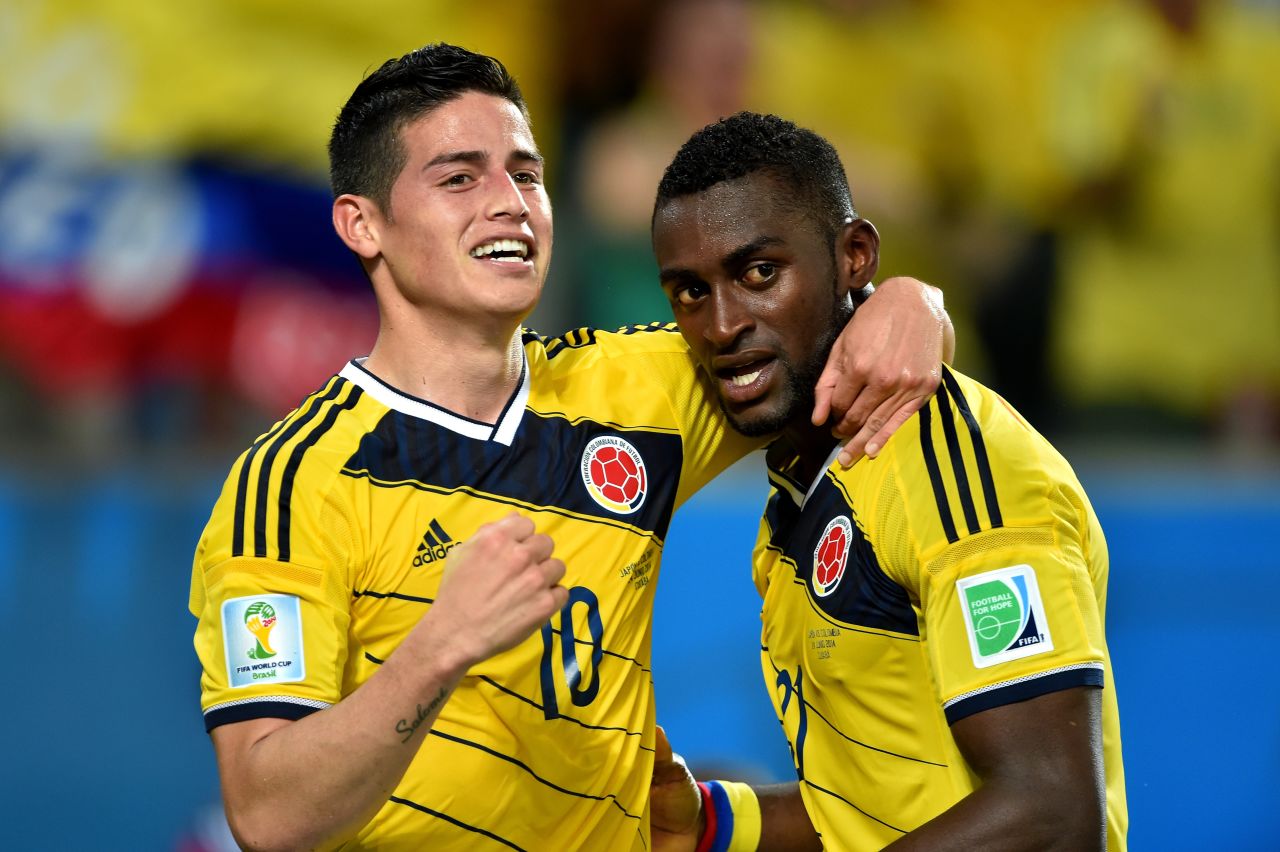 Jackson Martinez of Colombia, right, celebrates with his teammate Rodriguez after scoring his team's third goal against Japan.
