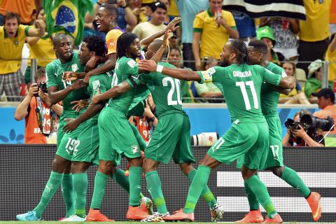 Ivory Coast's Wilfried Bony, second from left, celebrates with teammates after scoring a goal against Greece.