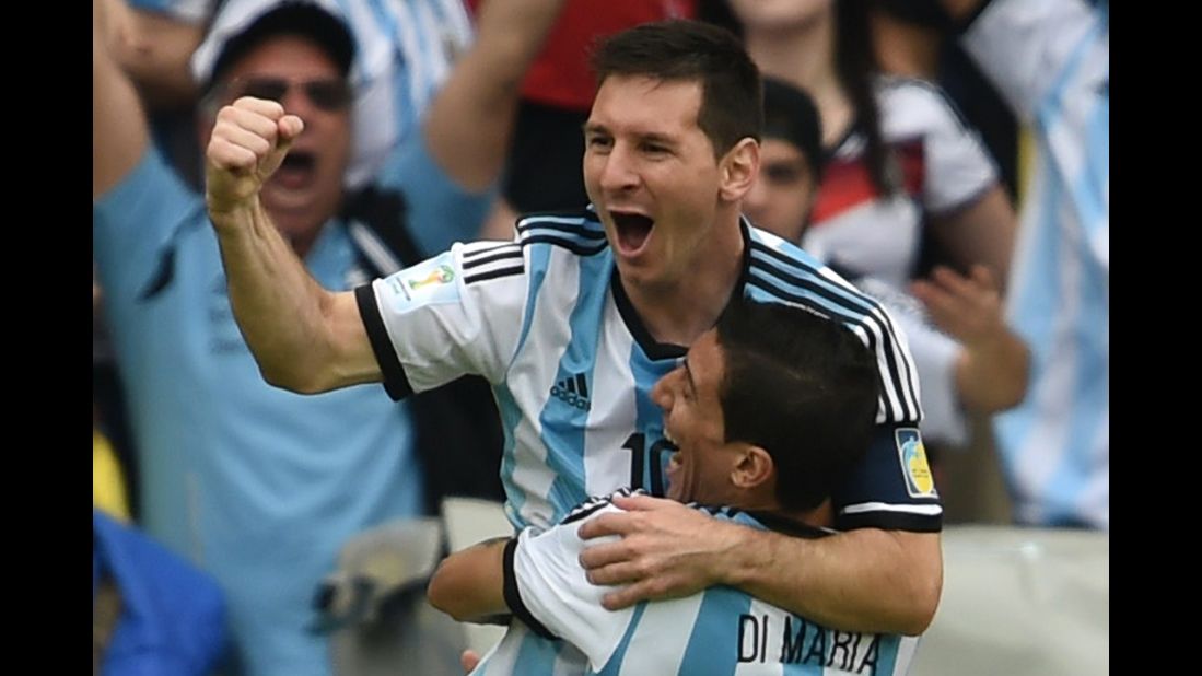 Messi, left, celebrates with his teammate Angel Di Maria, after scoring his team's first goal against Nigeria.