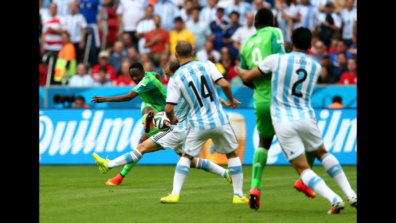 Ahmed Musa, far left, of Nigeria scores his team's first goal. 