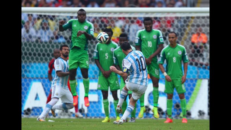 Argentina forward Lionel Messi scores his team's second goal against Nigeria.