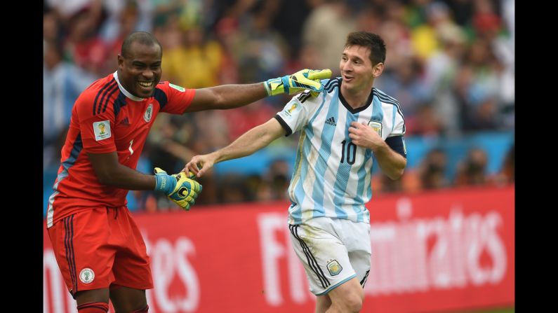 Argentina's forward Lionel Messi, right, and Nigeria's goalkeeper Vincent Enyeama smile during the game. 