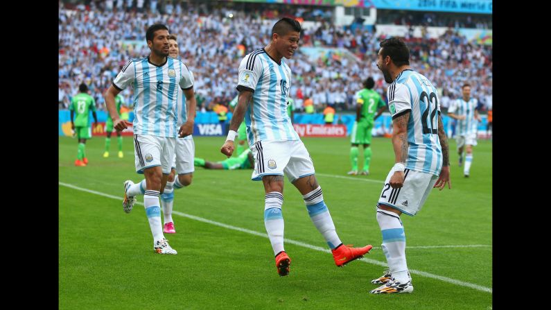 Marcos Rojo of Argentina, center, celebrates scoring his team's third goal with Ezequiel Garay, left and Ezequiel Lavezzi. 
