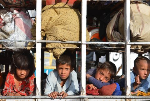 Pakistani children arrive by truck in Bannu, after fleeing the North Waziristan tribal region on June 20. As of Wednesday, 455,000 people had fled, according to the United Nations and the government.