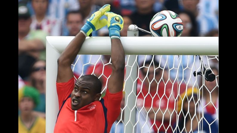 Nigeria's goalkeeper Vincent Enyeama jumps to block the ball. 