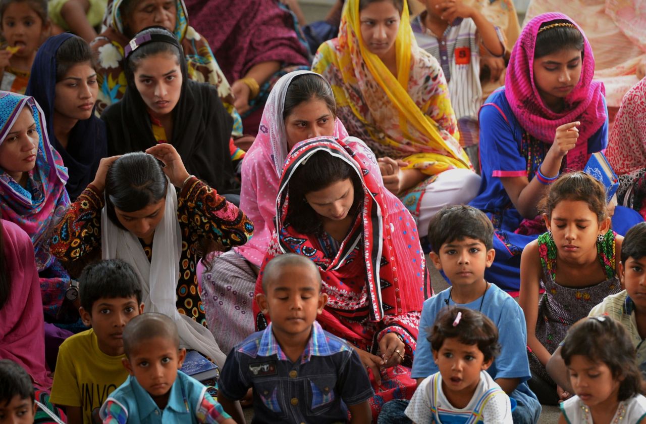 Displaced Pakistani Christians attend a church service. Most of the people fleeing are women and children. The men have stayed at home to protect their homes and livestock.