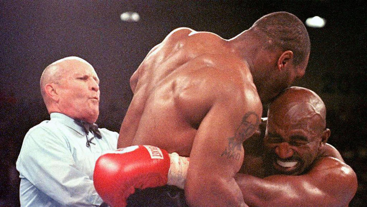 Referee Lane Mills stepped in after Mike Tyson bit Evander Holyfield's ear in the third round of their 1997 WBA Heavyweight Championship Fight at the MGM Grand Garden Arena in Las Vegas, NV.