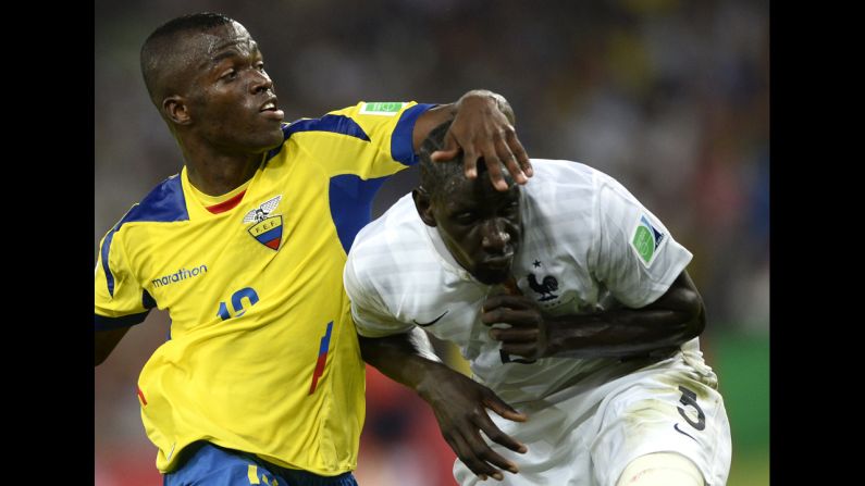 Ecuador forward Enner Valencia, left, and France defender Mamadou Sakho compete for the ball.