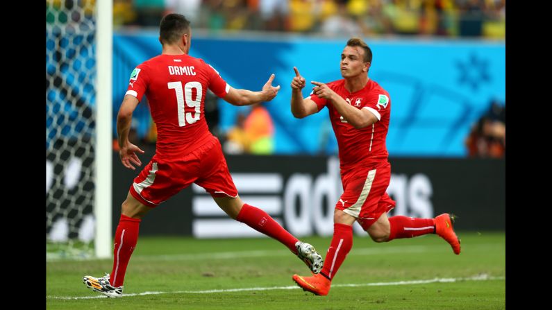 Xherdan Shaqiri, right, of Switzerland celebrates scoring his team's second goal against Honduras with teammate Josip Drmic.