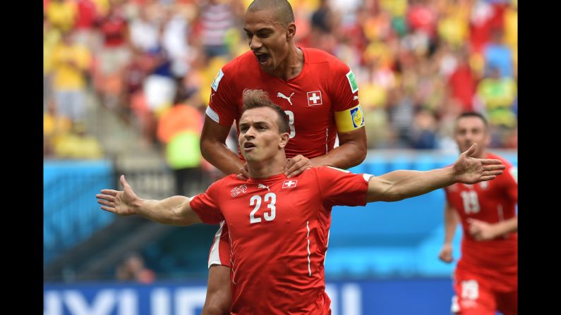 Switzerland midfielder Shaqiri, left, celebrates with midfielder and captain Goekhan Inler after a score.