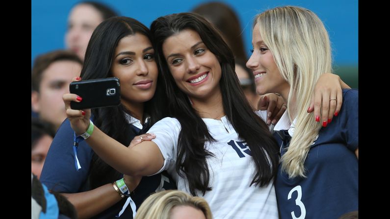 Wives and girlfriends of the French squad take a selfie.