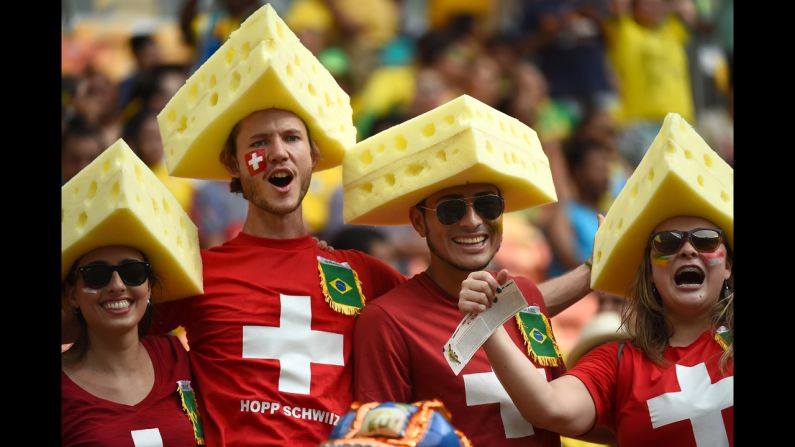 Swiss fans cheer for their team before the start of the match between Honduras and Switzerland at the Amazonia Arena.