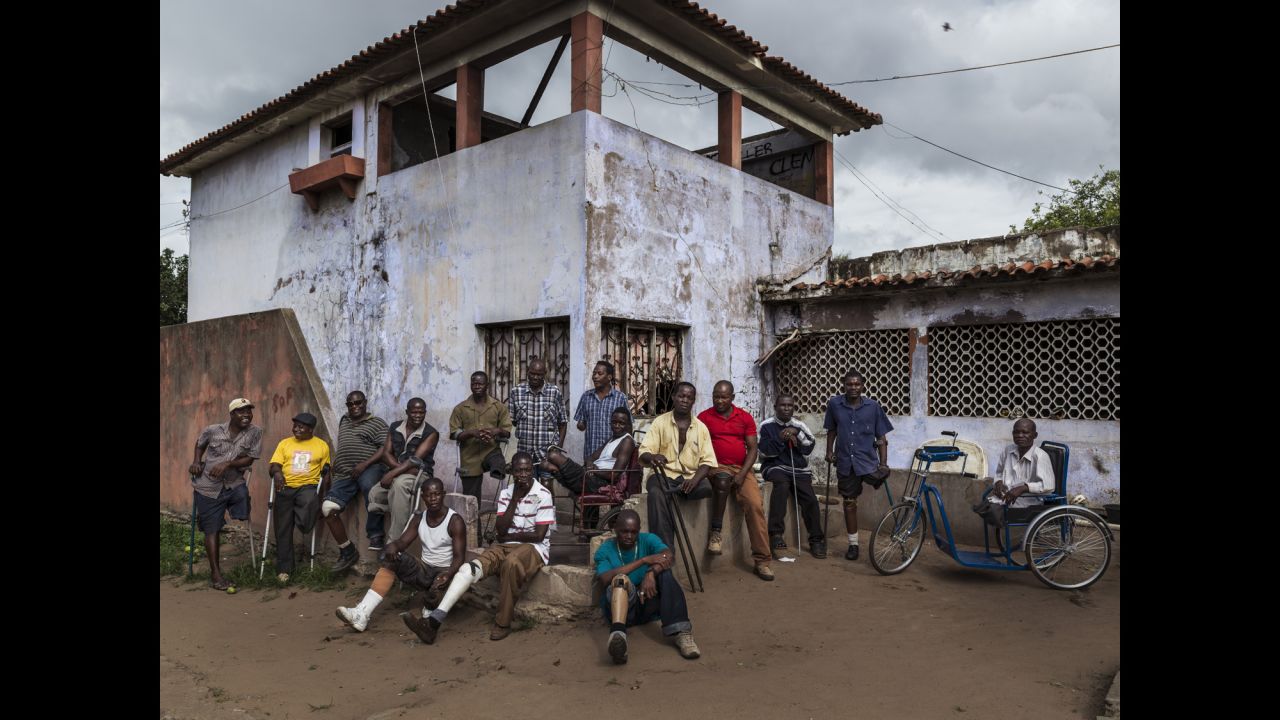 Former Mozambique Liberation Front soldiers are seen at their squatter housing in an abandoned building. Most of them are disabled as a result of land mine blasts. They receive a small pension every month from the government.