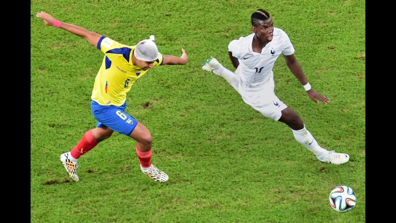 Ecuador's Cristhian Noboa, left, challenges France's Paul Pogba during a World Cup match in Rio de Janeiro on Wednesday, June 25. The game ended 0-0.