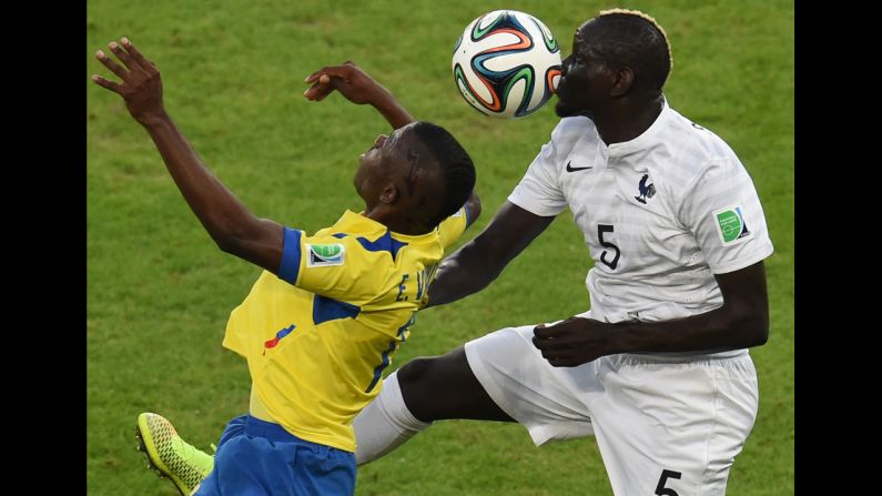Ecuador's Enner Valencia, left, and France's Mamadou Sakho vie for the ball.