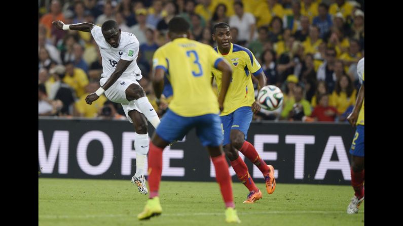 France's Moussa Sissoko, left, kicks the ball.