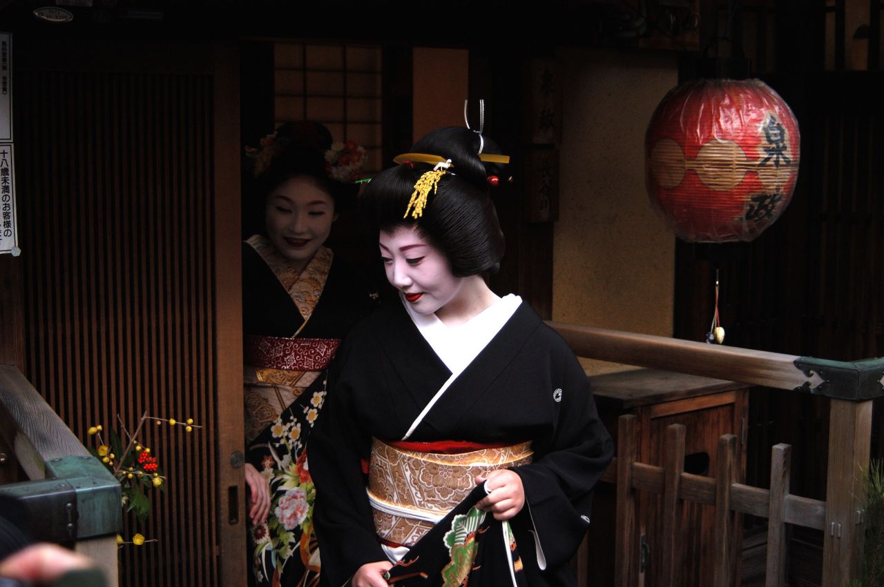 "Geisha are aware they are special ... and subject to interest, but people need to respect them," says Avi Lugasi, who runs a travel company in Kyoto. He helps clients get photos such as this one of an apprentice geisha leaving a tea house in Gion district. 