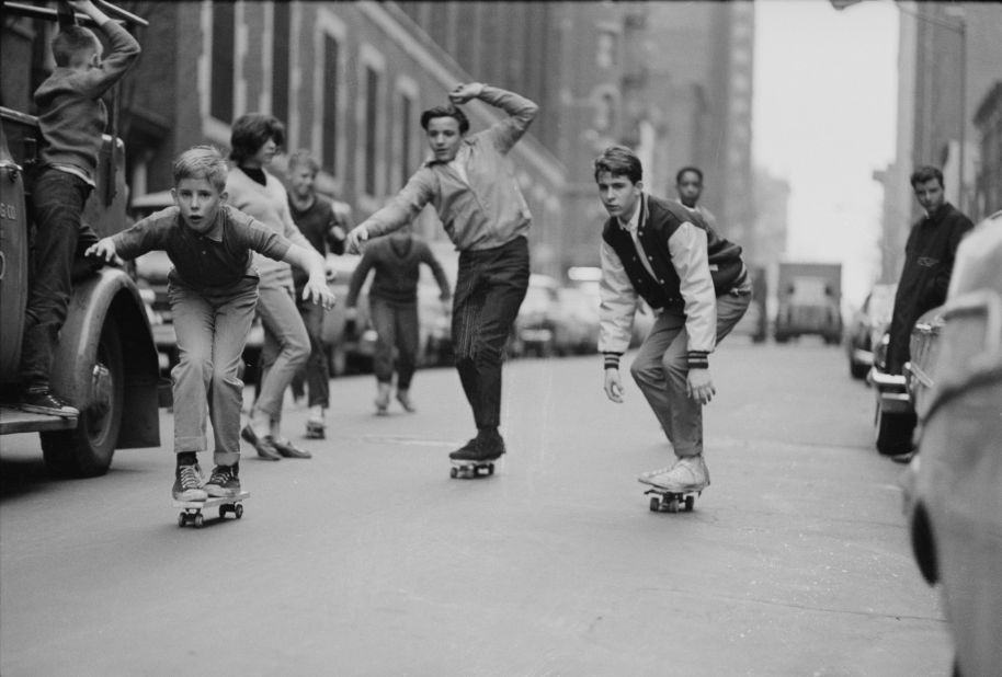 Skateboards had just started to take off in 1963, after onetime California lifeguard Larry Stevenson perfected a wheeled version of the surfboard. During the summer of 1964, the boards spread around the United States. Here, boys skate past cars on the streets of New York in 1965.