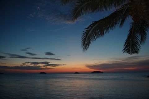 The sun sets over the Andaman Sea off the coast of <a href="http://ireport.cnn.com/docs/DOC-1145792">Phuket, Thailand</a>, in July 2013, as seen in this photo by John Vogel.