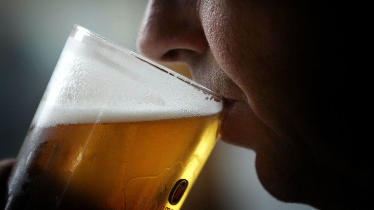 GLASGOW, SCOTLAND - NOVEMBER 26: A man drinks a pint of beer. November 26, 2004,  Glasgow, Scotland. The Scottish Executive has announced a major campaign designed to call time on the binge drinking culture which creates bad health and anti social behaviour. It is estimated that drink related problems cost the people of Scotland over ￡1bn a year.  Glasgow City Council has already banned "happy hours" where cut price drinks can be bought at specific times. (Photo illustration by Chris Furlong/Getty Images )