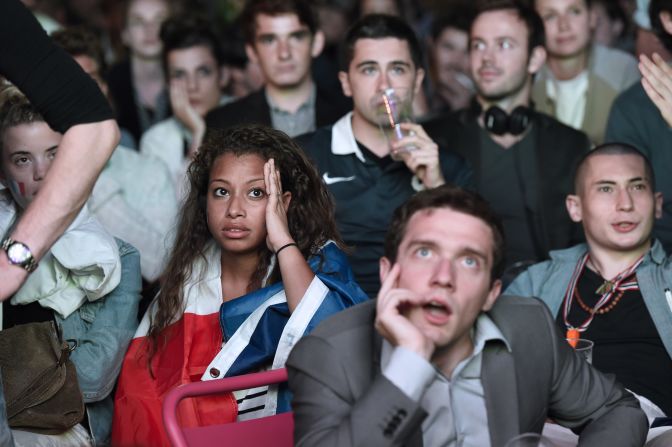 Spectators in Paris react as they watch the group-stage match between France and Ecuador on Wednesday, June 25. It ended 0-0.