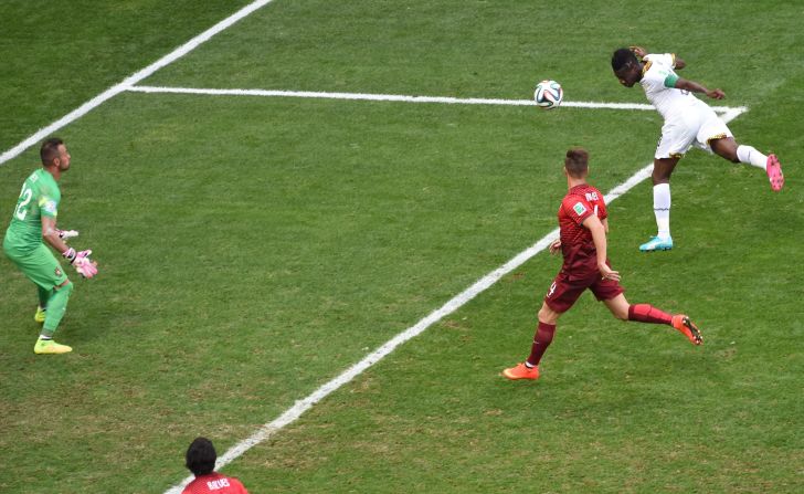 Ghana's Asamoah Gyan heads the ball to score a goal against Portugal during a World Cup game in Brasilia, Brazil, on June 26.