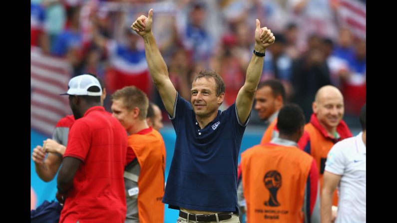Head coach Jurgen Klinsmann of the United States acknowledges the fans after his team's 1-0 loss to Germany in Recife, Brazil. Despite the loss, the U.S. team advances to the round of 16 in the 2014 World Cup.