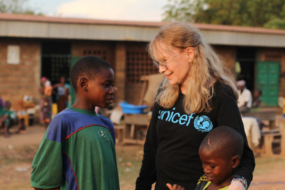 Mia Farrow meets brothers Oumarou and Adamou Bouba, 13 and 10, at the Bossangoa camp 