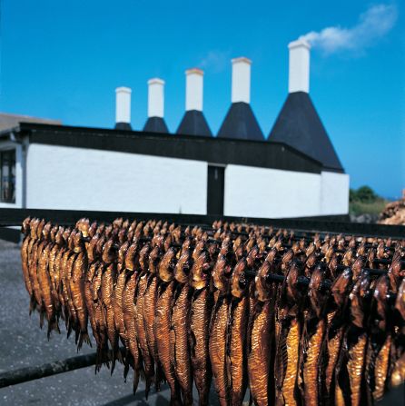 The island of Bornholm is famed for its signature dish of smoked herring, making the Bornholm Smokehouses a fishy success story.<br />With distinct tall white chimneys and pungent aroma, the smokehouses are hard to miss, but are worth a visit for herring fans.<br /><em>More info: </em><a href="index.php?page=&url=http%3A%2F%2Fwww.visitdenmark.com%2F" target="_blank" target="_blank"><em>www.visitdenmark.com</em></a><br /><a href="index.php?page=&url=http%3A%2F%2Ftravel.cnn.com%2Fno-chance-noma-6-copenhagens-other-great-restaurants-902686"><em>More: No chance at Noma? 6 of Copenhagen's other great restaurants</em></a>