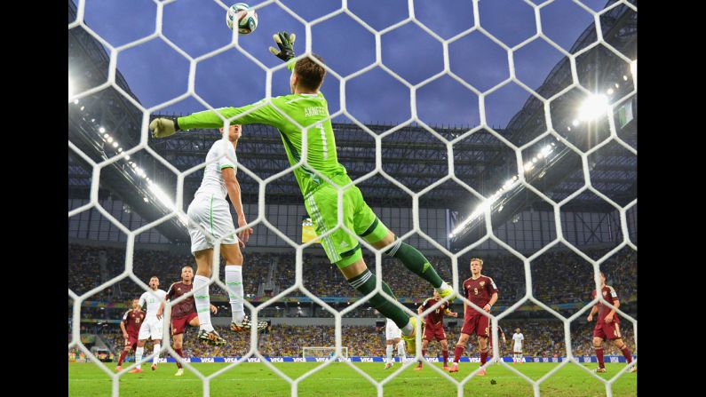 Igor Akinfeev of Russia makes a save against Algeria.