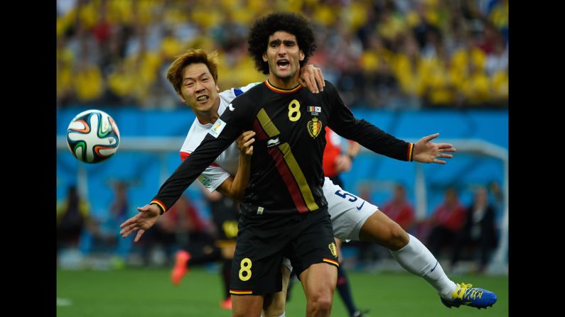 Young-Gwon, left, vies with Belgium midfielder Marouane Fellaini. 