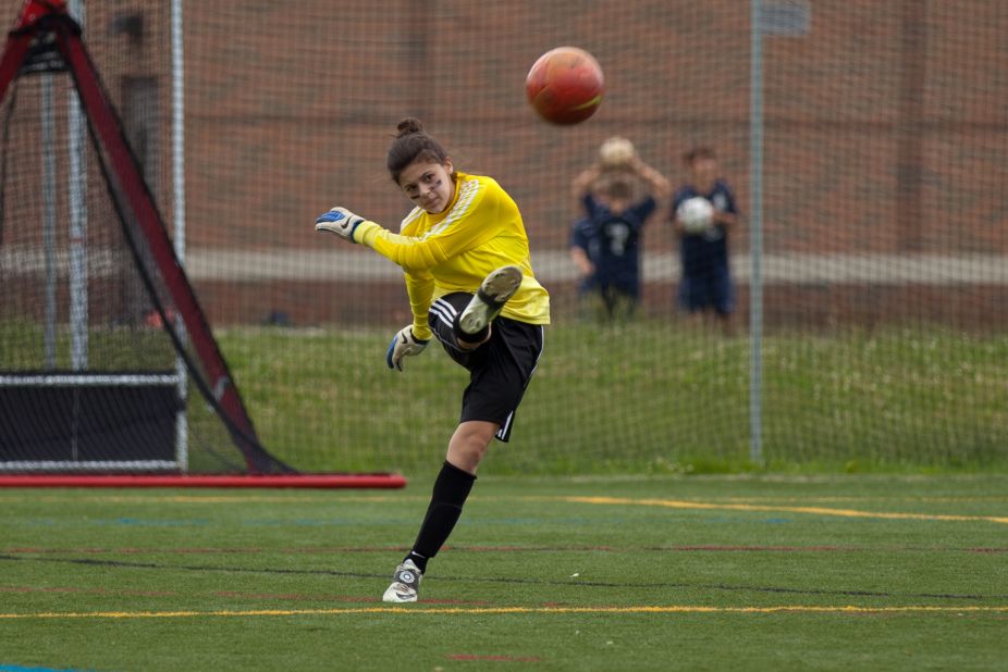 Lauren Jockimo, 13, plays goalkeeper in the league. Here, she gives the ball a good punt after <a href="http://ireport.cnn.com/docs/DOC-1135365">making a save</a>.