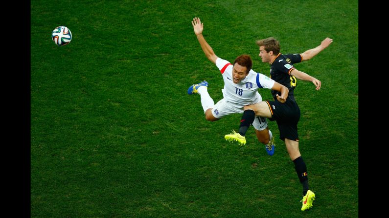 Nicolas Lombaerts of Belgium challenges Kim Shin-Wook of South Korea.
