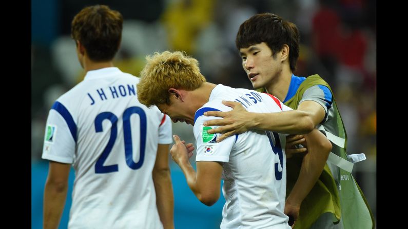 South Korea midfielder Son Heung-Min, center, reacts after losing to Belgium during a World Cup match at the Corinthians Arena in Sao Paulo, Brazil. Belgium won 1-0.