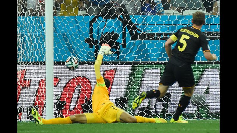 Belgium defender Jan Vertonghen, right, scores