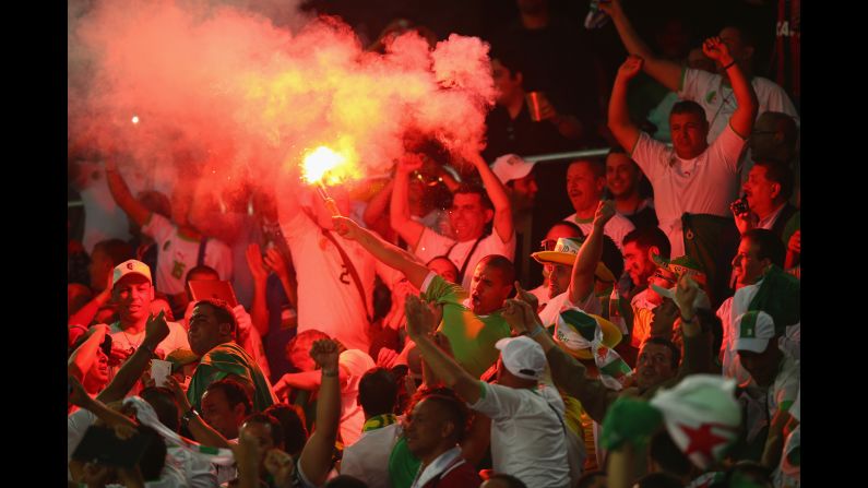 Algeria fans celebrate their team's first goal.