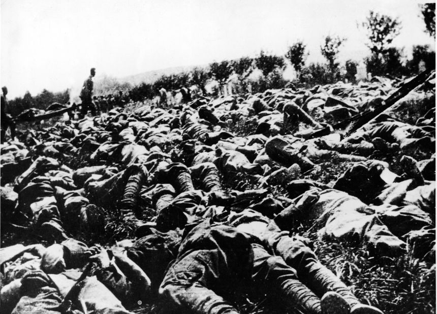 The bodies of hundreds of Italian soldiers are strewn across the battlefield, victims of a gas and flame attack during World War I, as others haul the wounded on stretchers. They were members of the Ninth Italian Regiment of the Queen's Brigade.