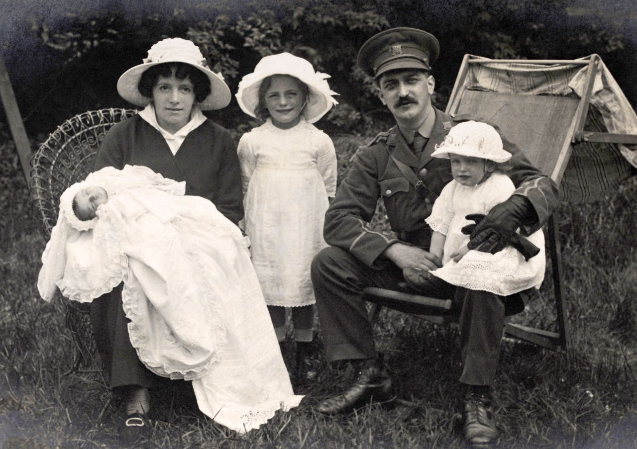 A British Army lieutenant sits in a garden with his wife and three children while on leave during the war. In Great Britain and the United States, women confronted wartime shortages of food, fuel and housing as they struggled to maintain homes and families while they also worked outside the home.