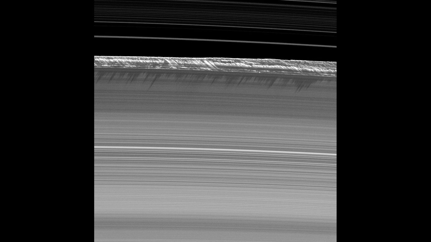 7. Vertical structures in the rings imaged for the first time. Once about every 15 years, the sun shines on the edge of the ring plane and northern and southern sides of the rings receive little sunlight. Cassini measured the thick, long shadows from this rare event to determine the heights of structures within the rings.